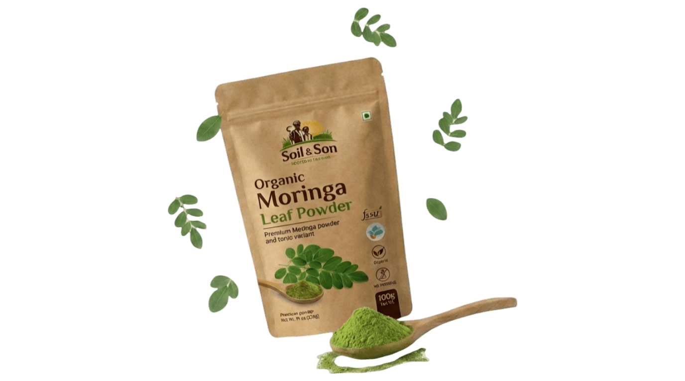 Soil & Son Moringa Leaf Powder package with wooden spoon and fresh moringa leaves